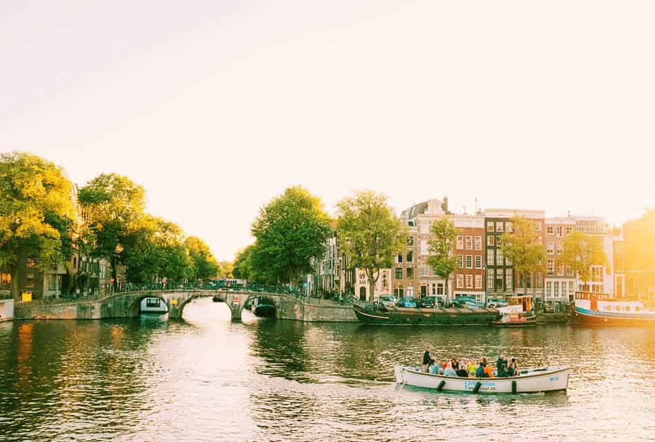 small boat on amsterdam canal