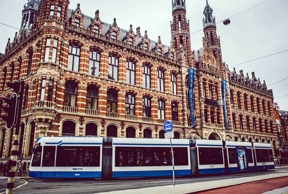 blue and white tram in amsterdam