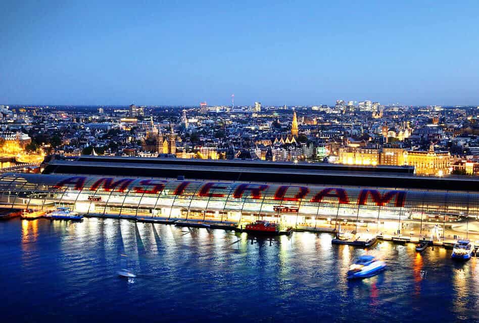 amsterdam written on roof of train station