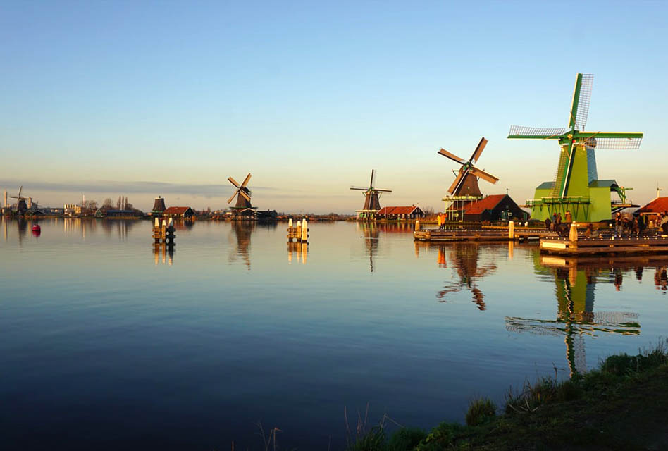 zaanse schans windmills dotted along river